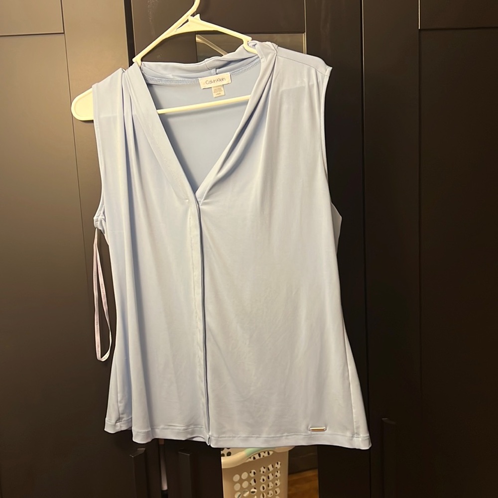 Blue sleeveless blouse